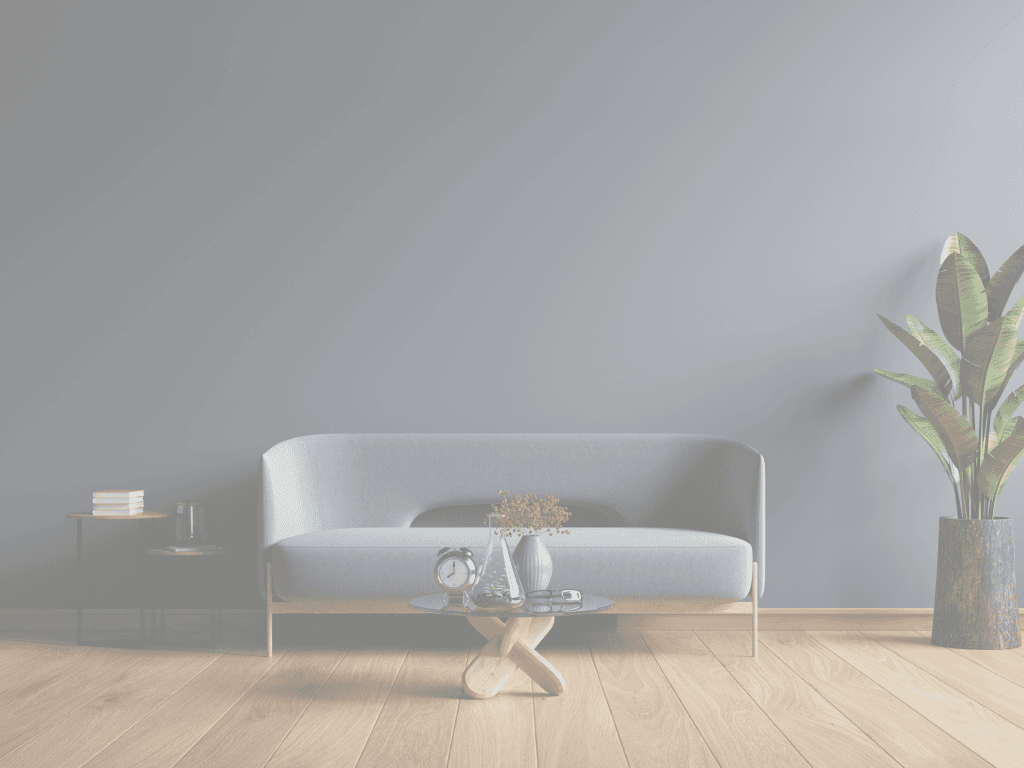 A prepared guest lounge with a green sofa