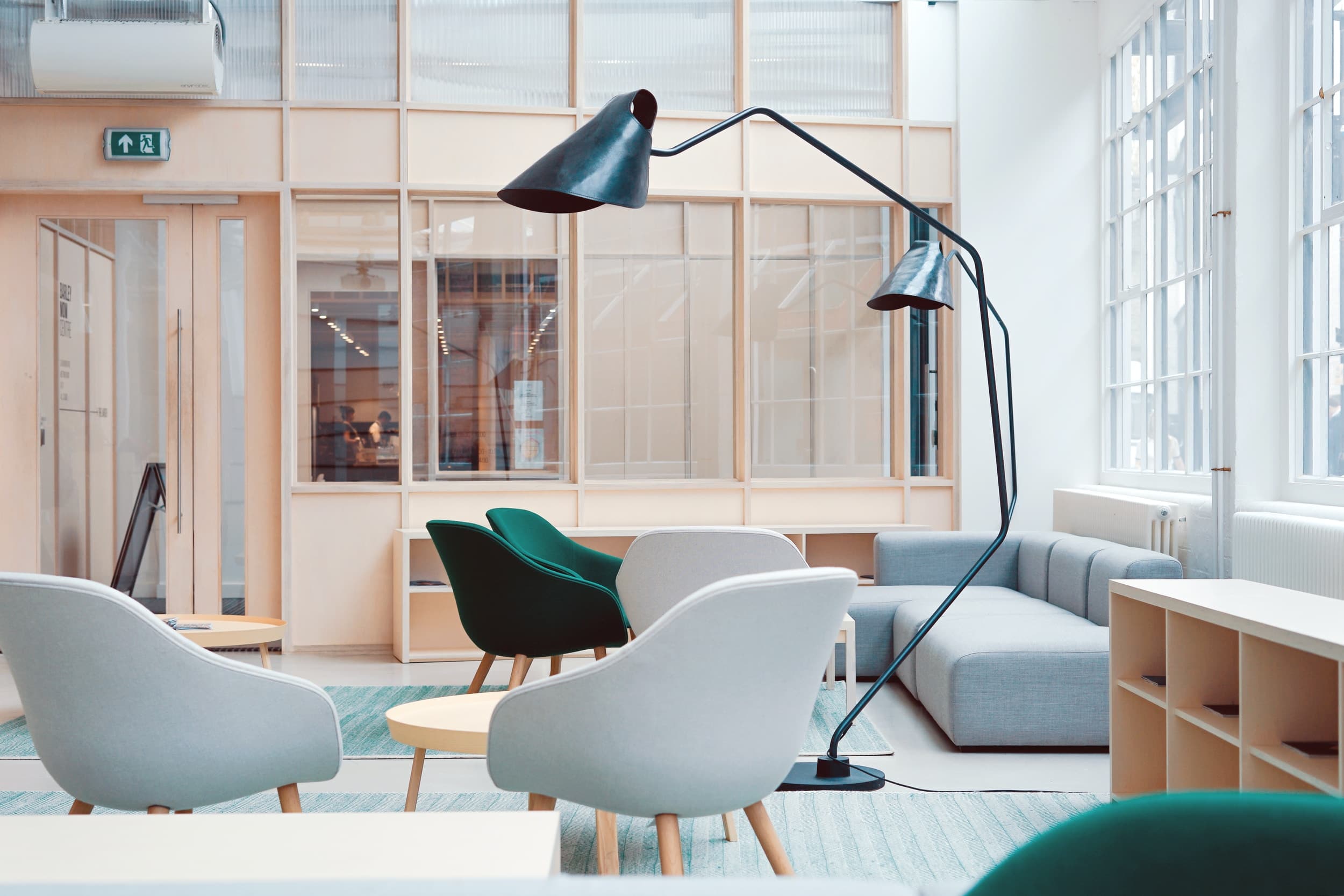 A welcoming seating area with a sculptural floor lamp